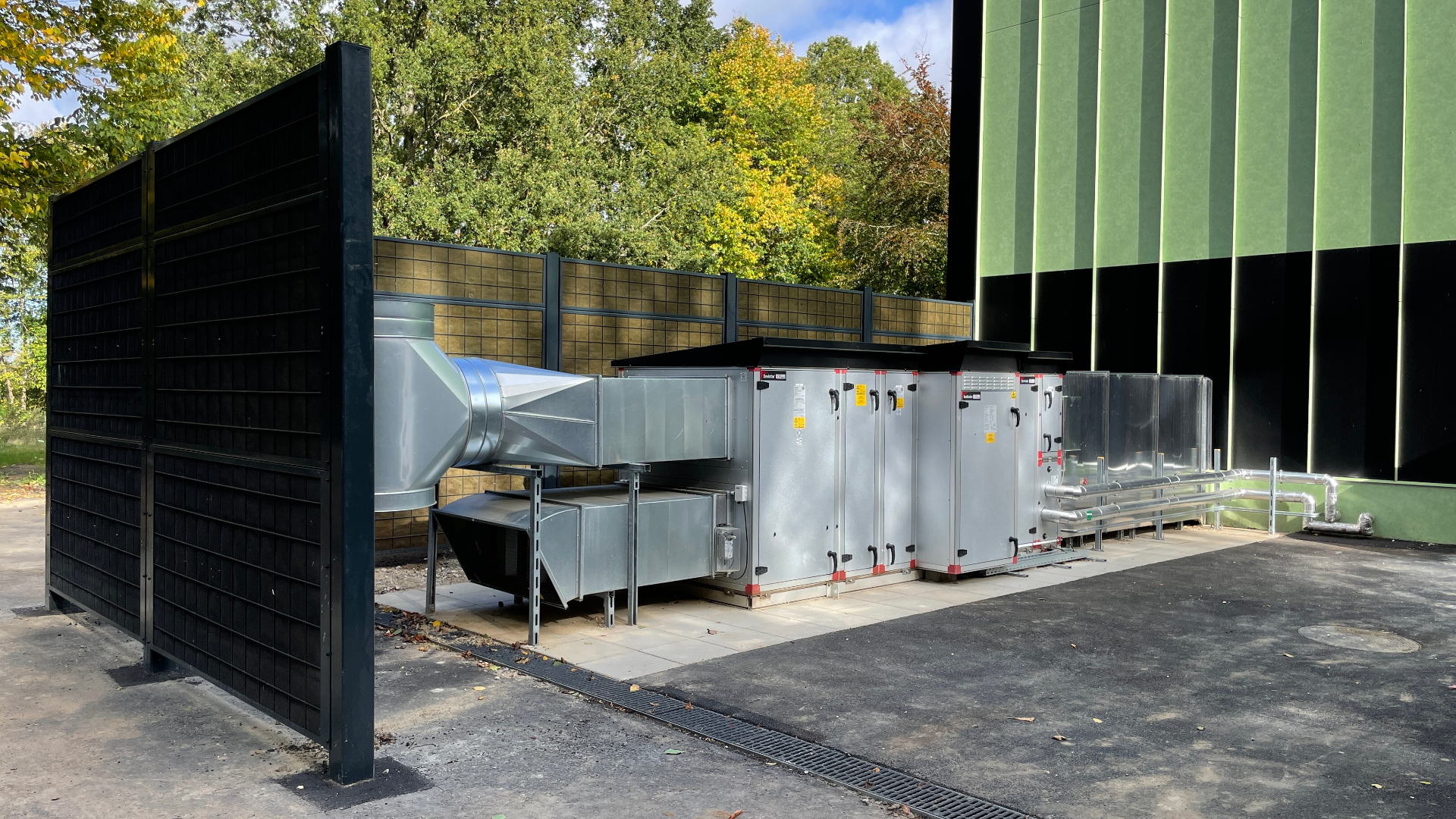 Noistop Steel anthracite as acoustic enclosure around a ventilation system at a commercial building