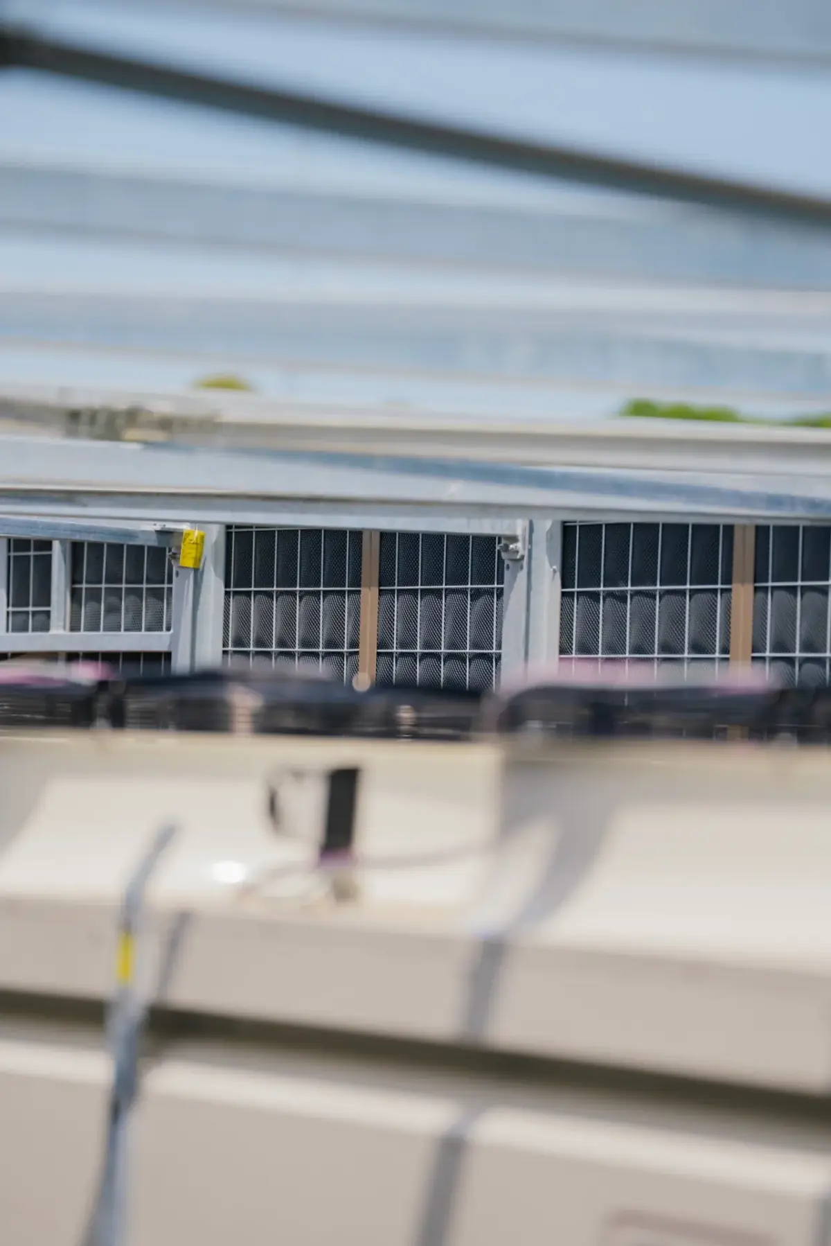 Close-up of Noise-Reducer panels with an integrated access door around technical rooftop equipment